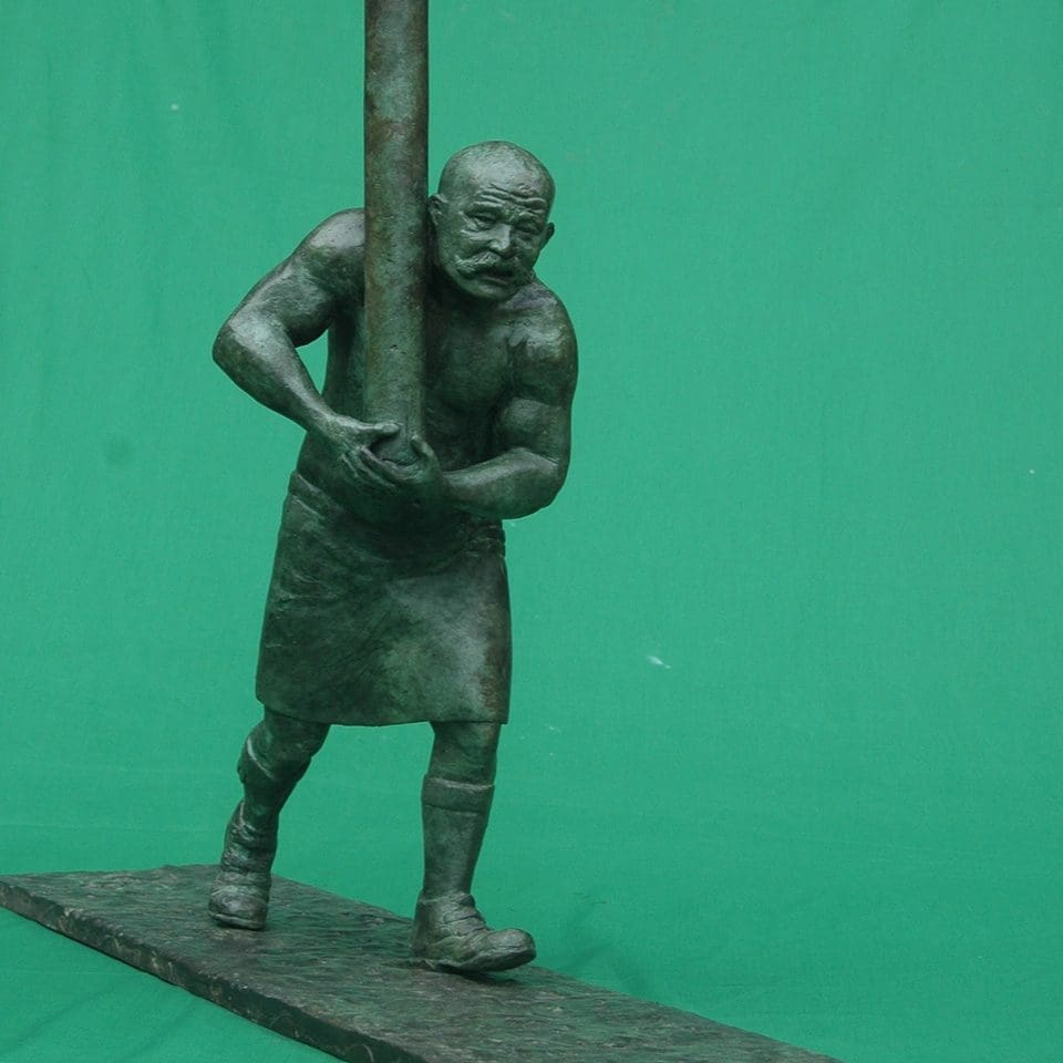 caber toss sculpture mc keane