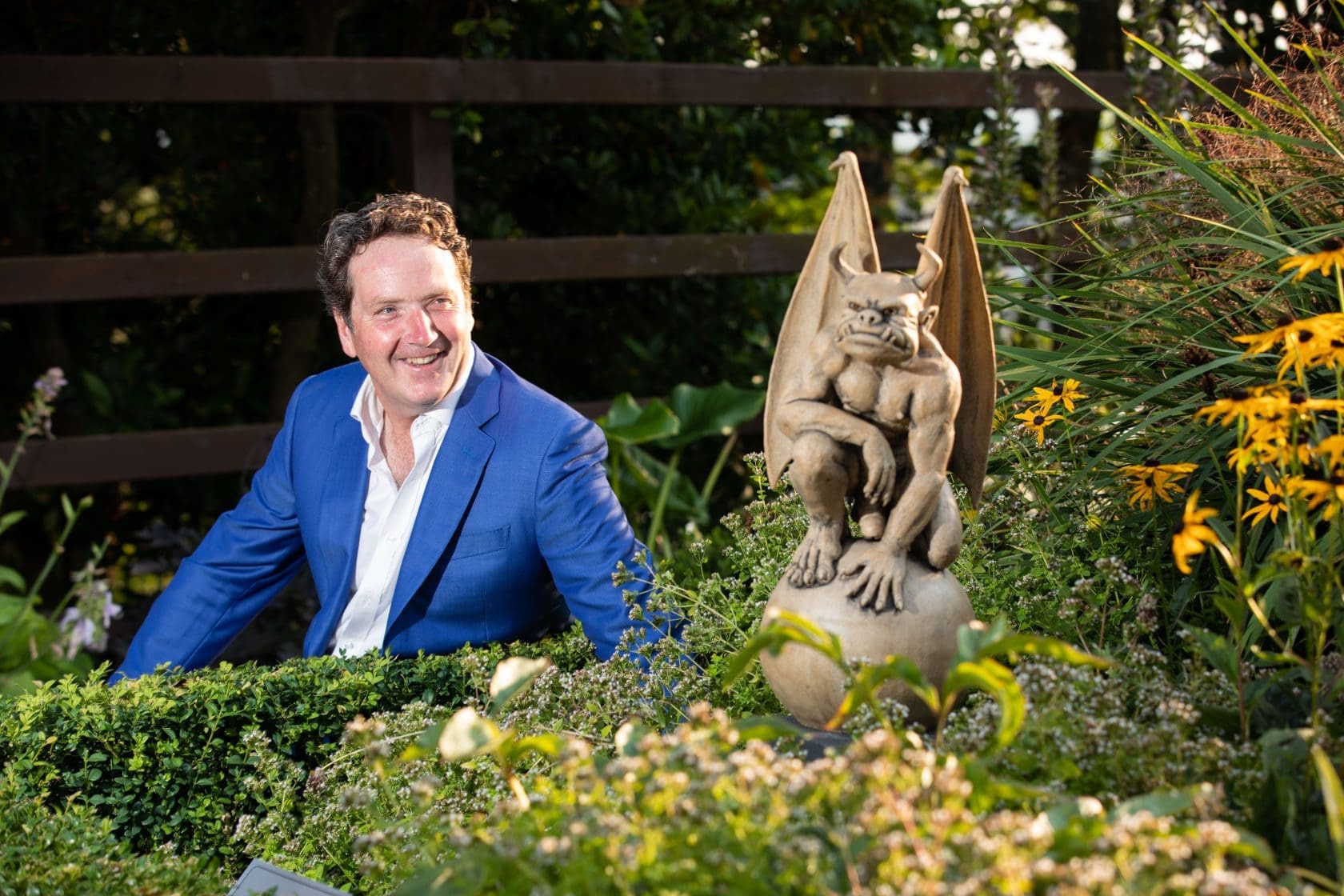 Gargoyle Sculpture with Diarmuid Gavin sitting at exhibition Gargoyle Sculpture with Diarmuid Gavin sitting at exhibition